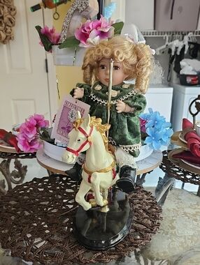 Porcelain Doll on Carousel Horse Figurine - Green Dress